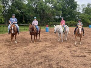 Four kids on horses