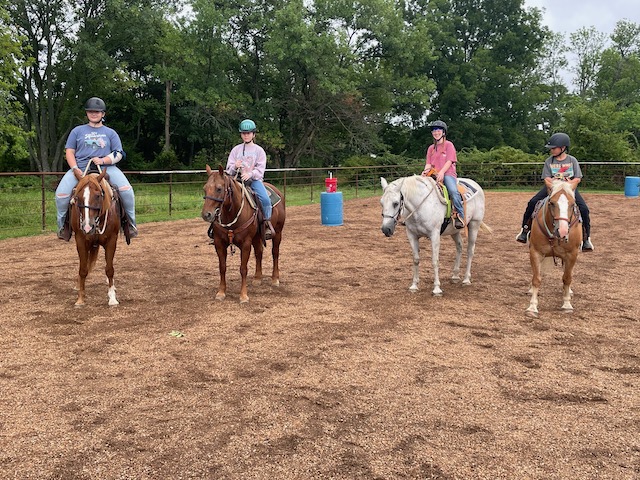 Four kids on horses